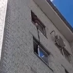 Свесил ноги с окна: видео спасения мужчины показали полицейские ЗКО