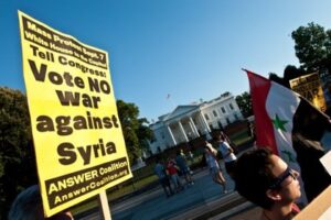 Акция против военной операции США в Сирии Фото: Nicholas Kamm / AFP